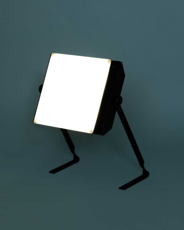 Light Up side view lit up on a turquoise background